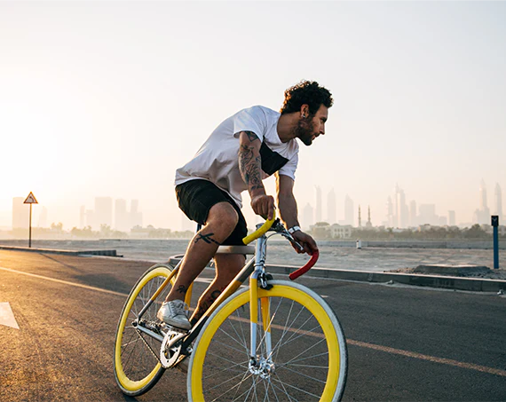 Cyclist commuting to work through the city